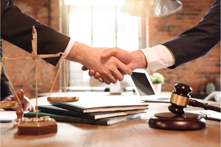 lawyer and client shaking hands