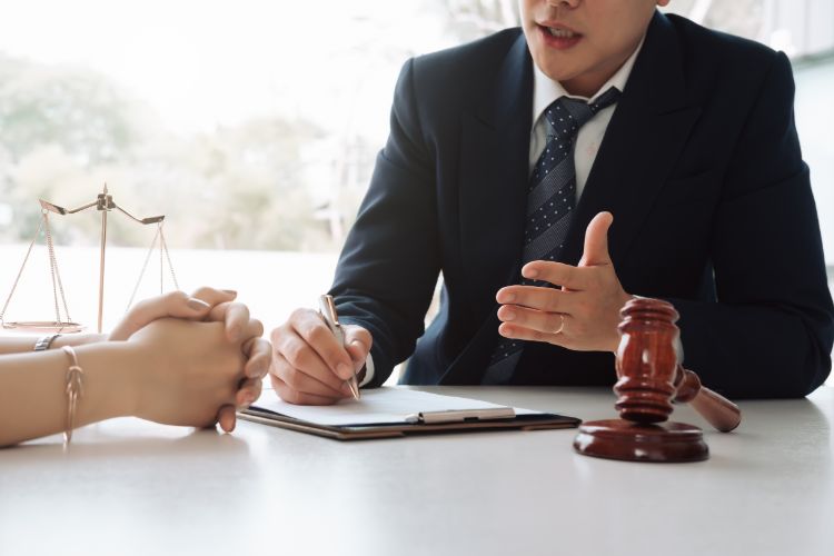 person consulting a lawyer with gavel