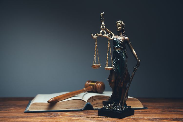 scales of justice, book of laws, and gavel