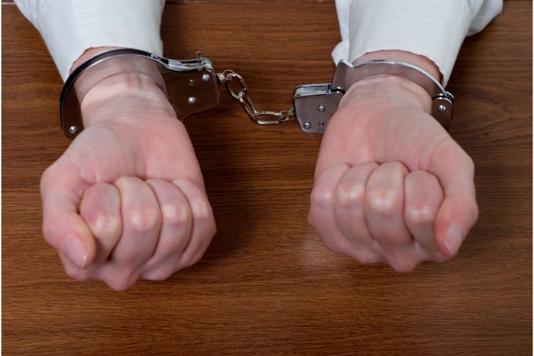 man's hands with cuffs