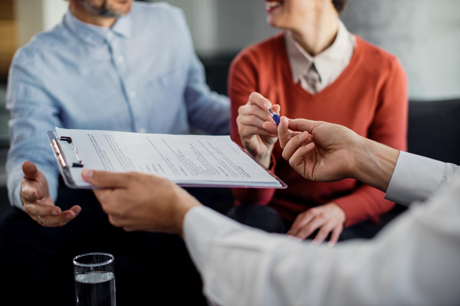 Life Insurance in Estate Planning: A Guide for Arizona Couple receiving legal documents during consultation with attorney in Mesa, Arizona, highlighting family law services.
