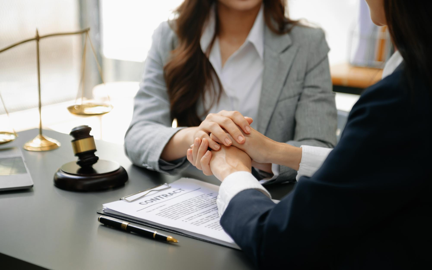 Exploring the Plea Bargain Process in Arizona’s Legal System Mesa attorney consultation with client, discussing contract details, legal support in East Valley, Arizona.