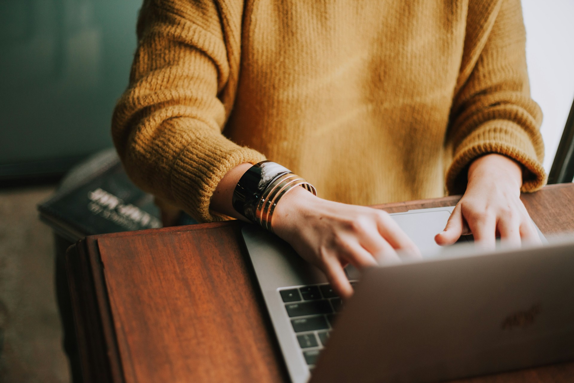 Person typing on laptop in Mesa, Arizona, representing legal consultations and services at Rowley Chapman & Barney law firm.