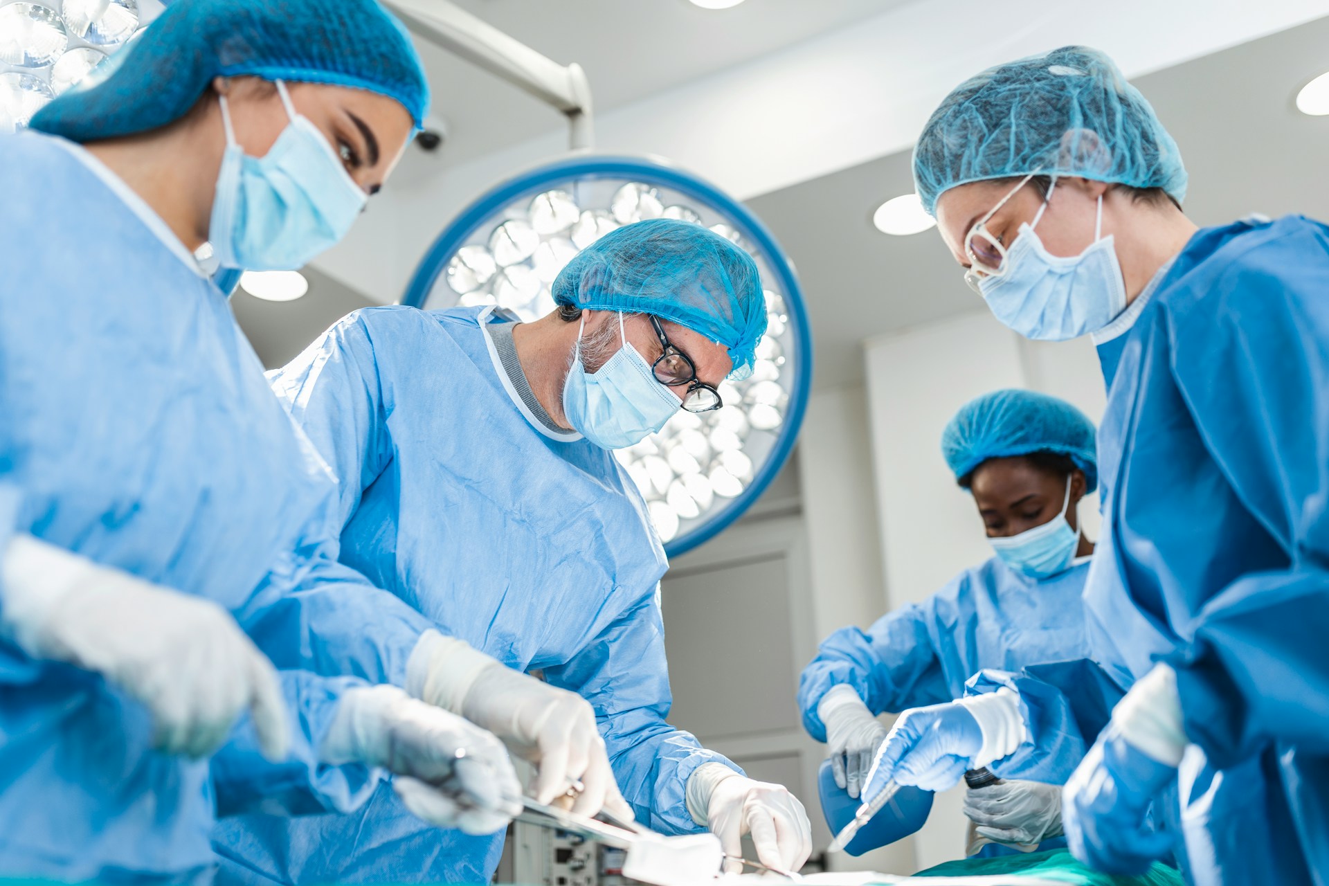 Medical professionals in surgical attire collaborating in a Mesa, Arizona operating room, highlighting medical malpractice context.